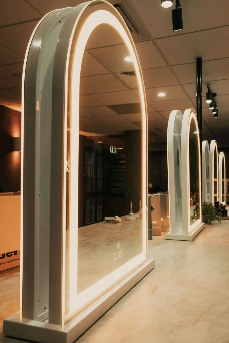 Illuminated arched makeup mirrors at FUSE Beauty Atelier