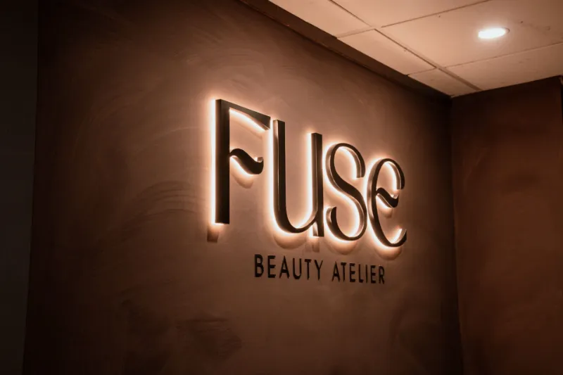 The illuminated FUSE Beauty Atelier sign